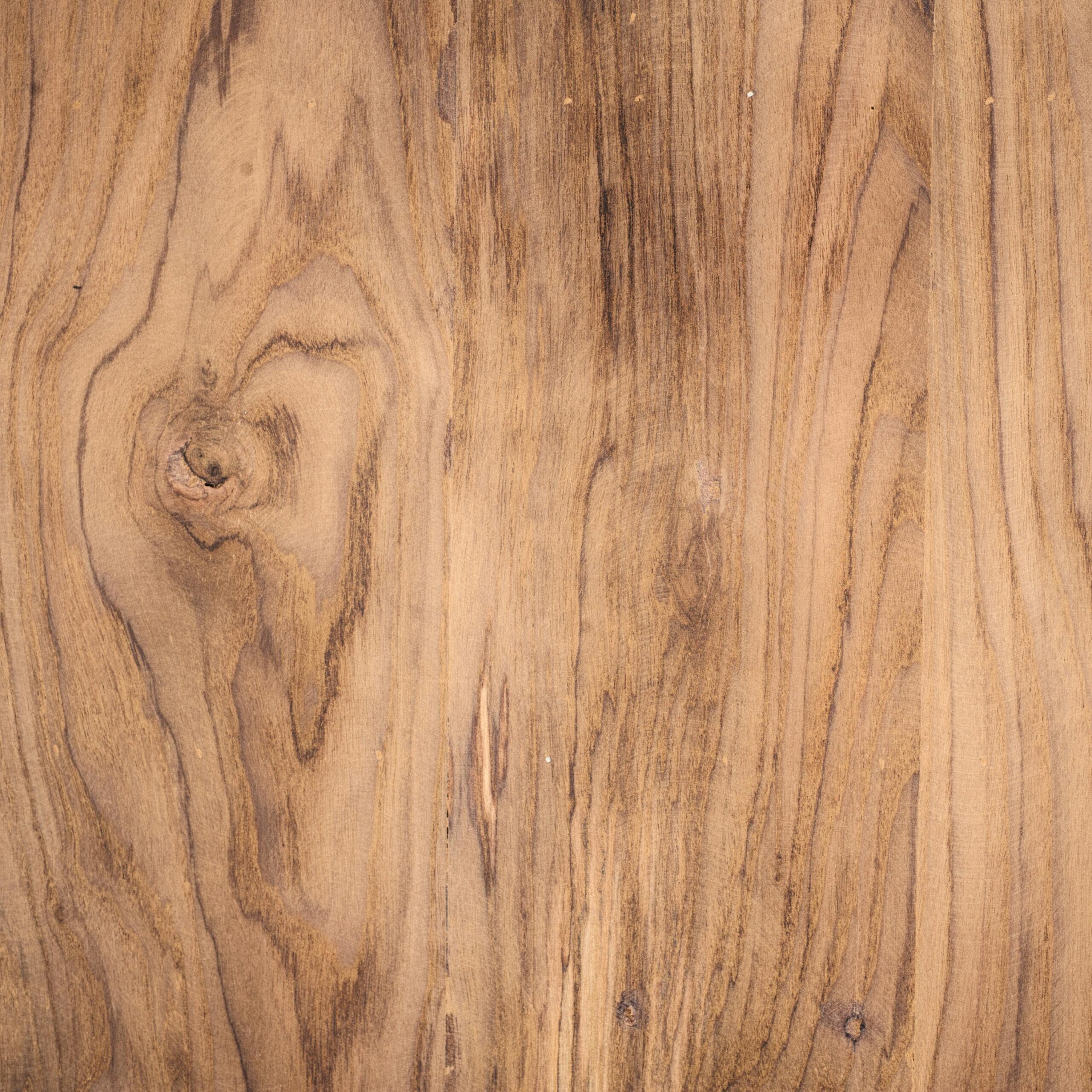 A detailed close-up of rustic wooden planks showing natural grain texture for backgrounds and design.